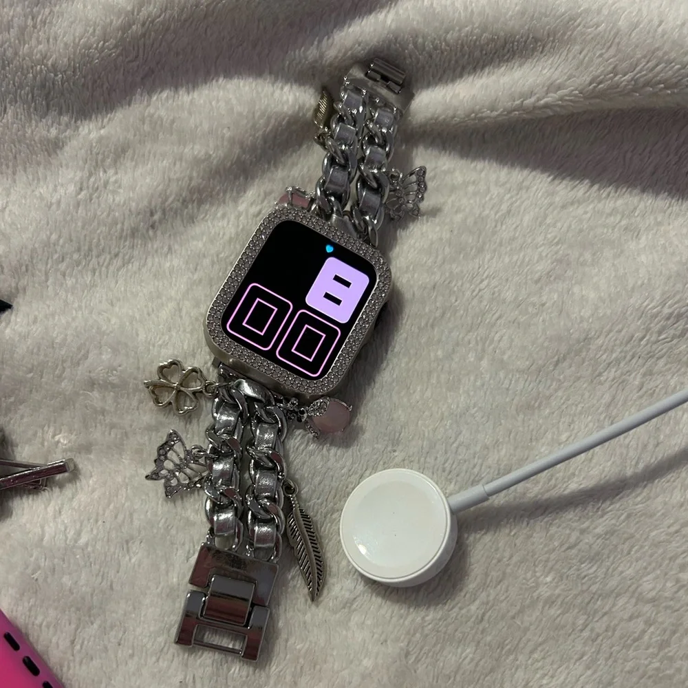 Apple Smartwatch Accessories with Pink and Black Bands and Silver Chain Bracelet